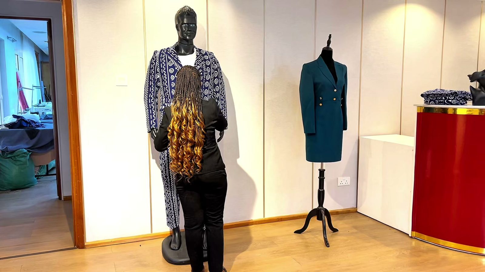 Finished garments on mannequins in the showroom